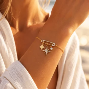 Bracelet doré Cosmic avec épingle sertie, étoiles et zircons