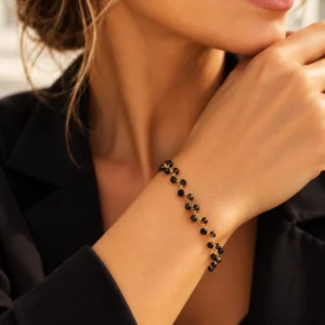 Bracelet doré Nuit Dorée avec perles noires facettées